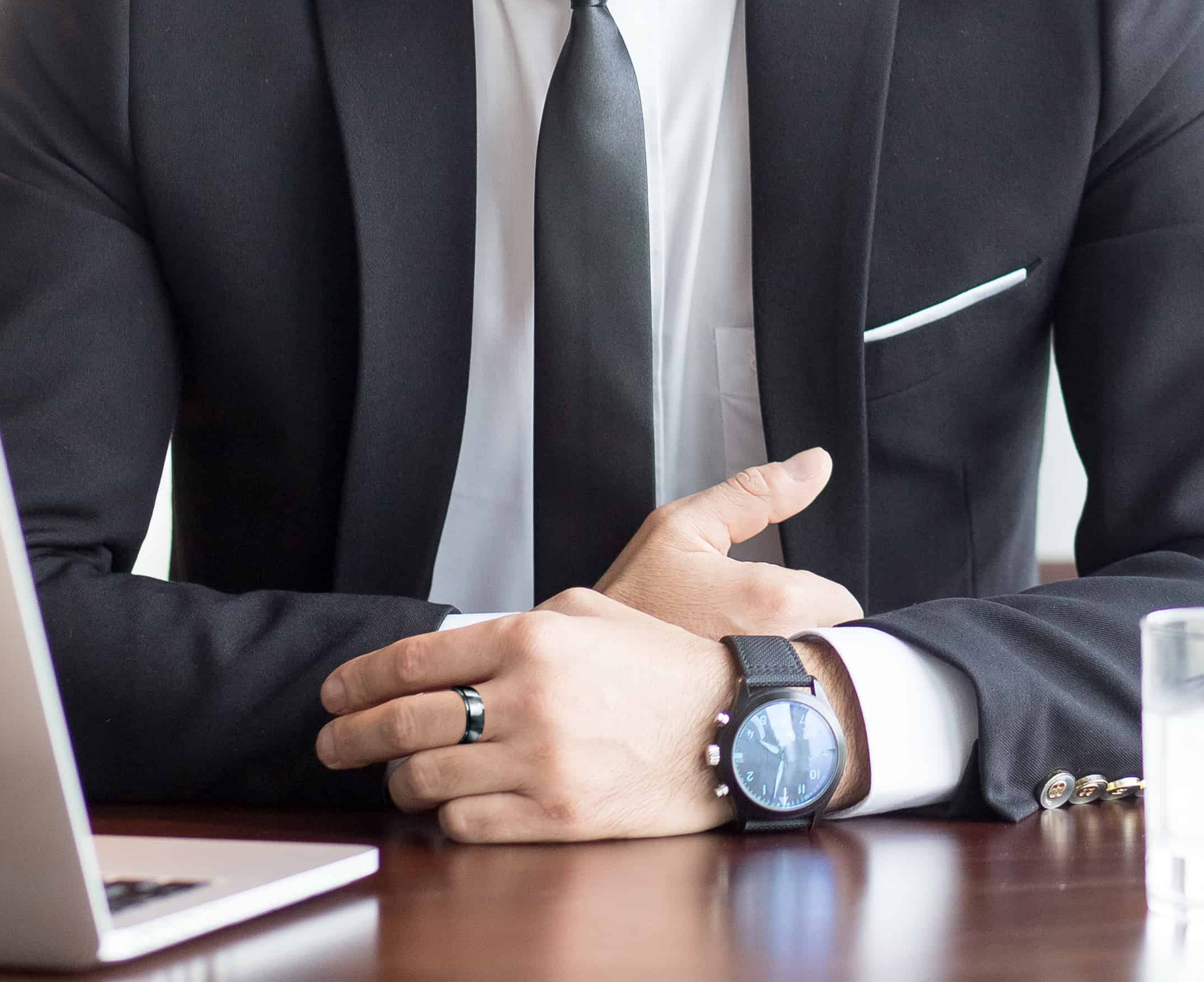 Man wearing black silicone ring with suit for formal occasions
