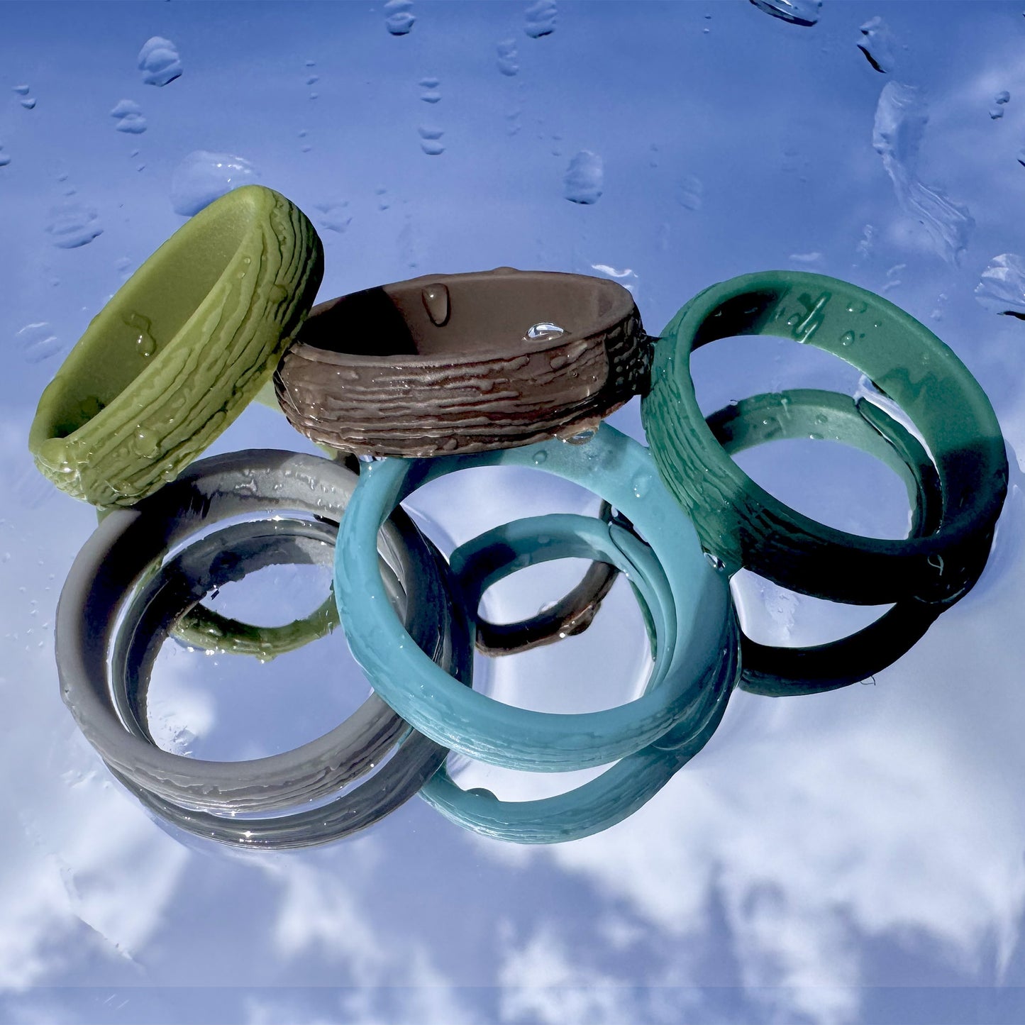 Ocean-tone silicone rings arranged together