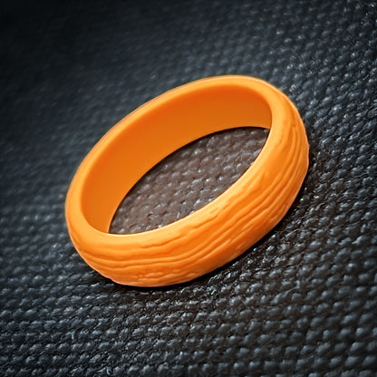 Amber orange silicone ring with DERSA size reference chart