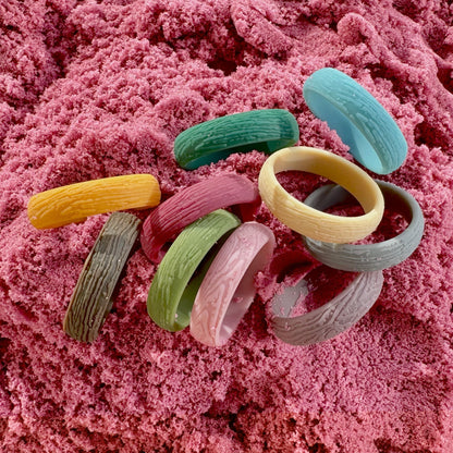 Woodgrain silicone rings worn on a hand