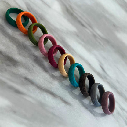 Earth-toned silicone rings arranged as a full set