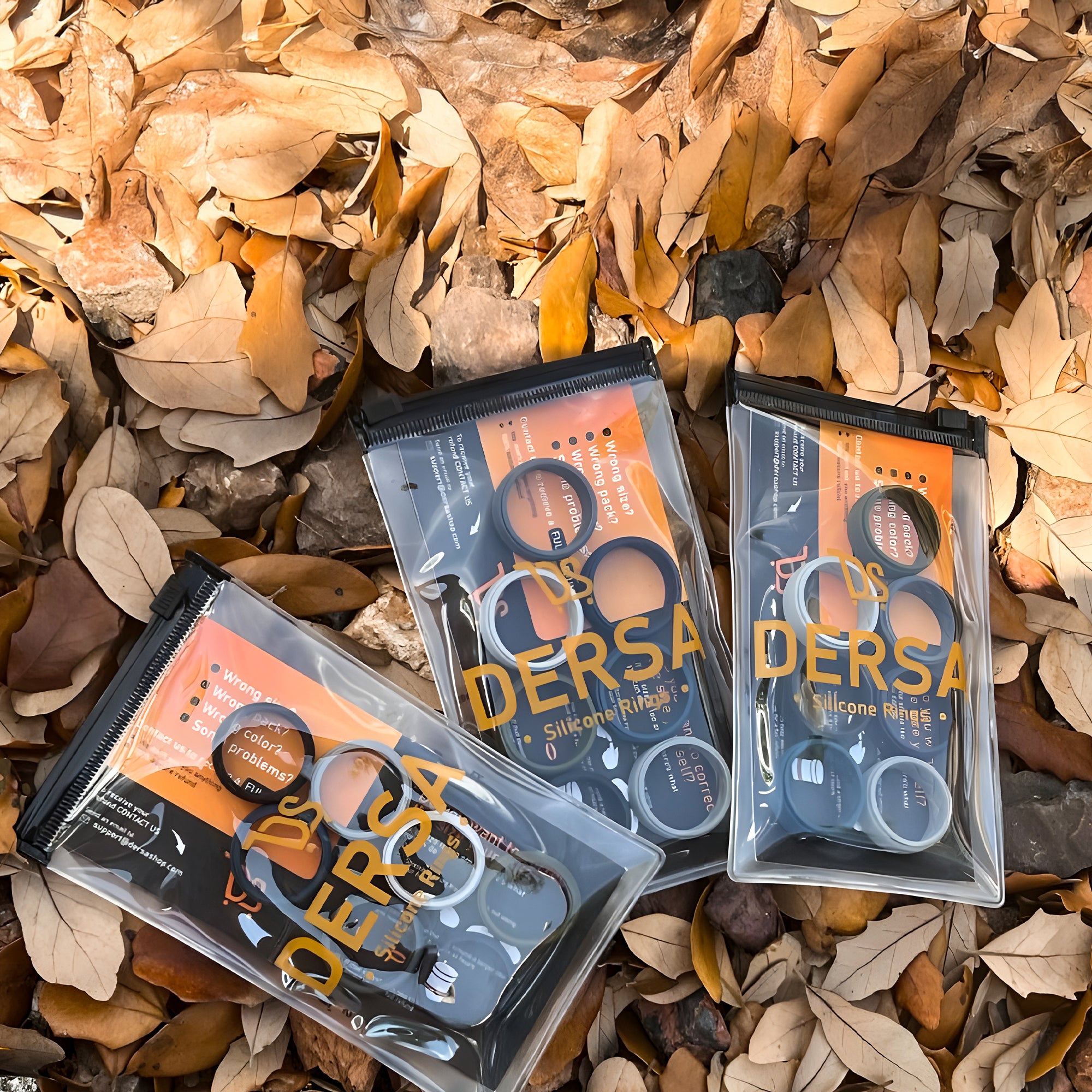 Dersa silicone ring packaging displayed outdoors on dry leaves – premium ergonomic ring packs for everyday use
